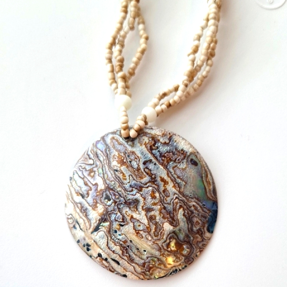 Elegant Beaded Necklace with Earthy Shell Pendant - Picture 1 of 3